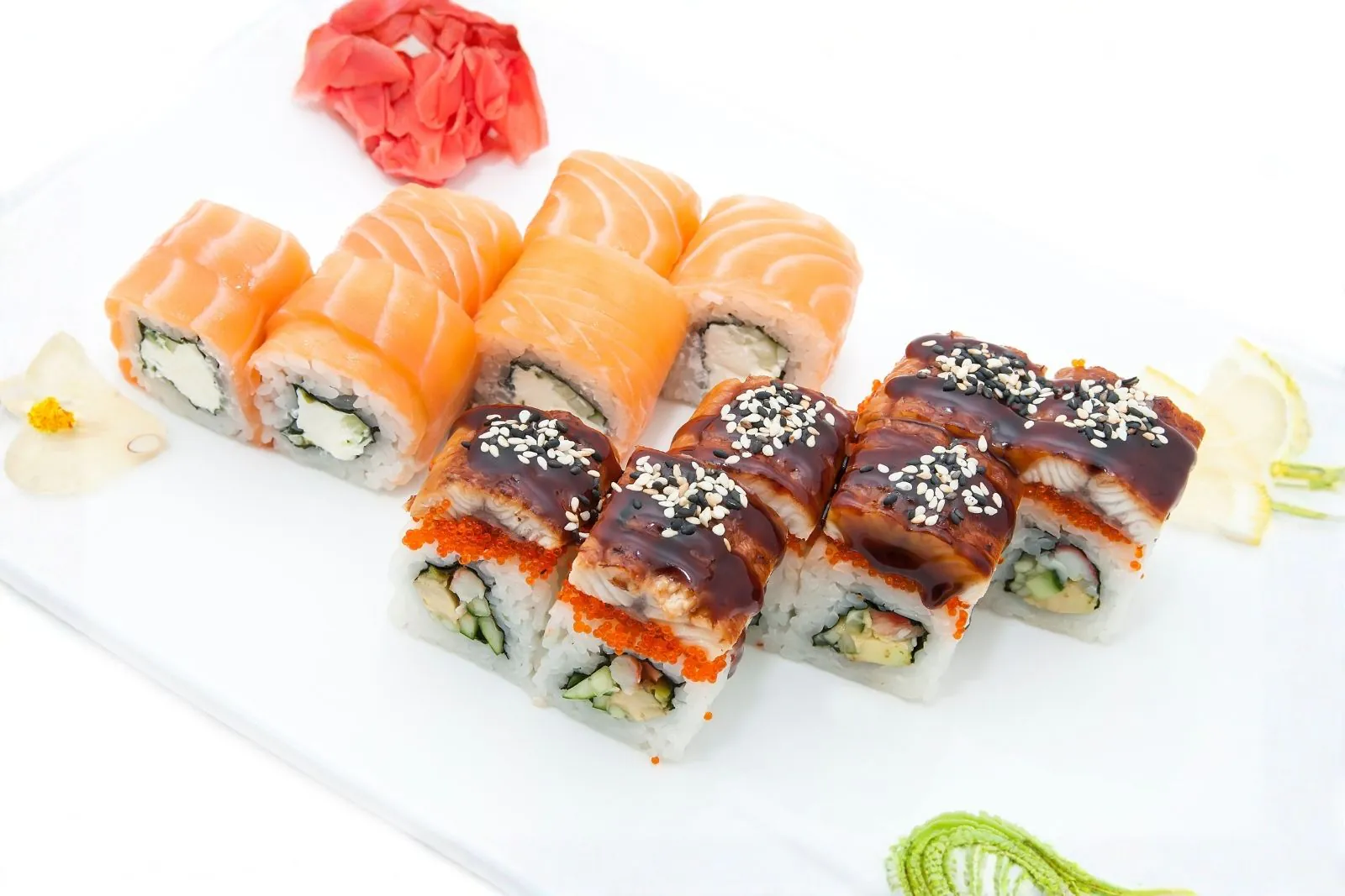 Duo of salmon cream cheese rolls and eel rolls with sesame seeds at Umiya Sushi, a Japanese Restaurant in Lubbock